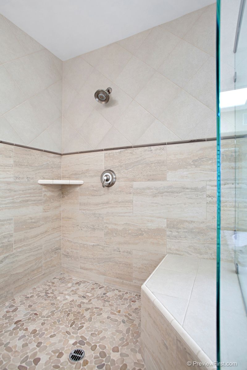 Eastlake shower mid-build: vertical subway tile on floated walls