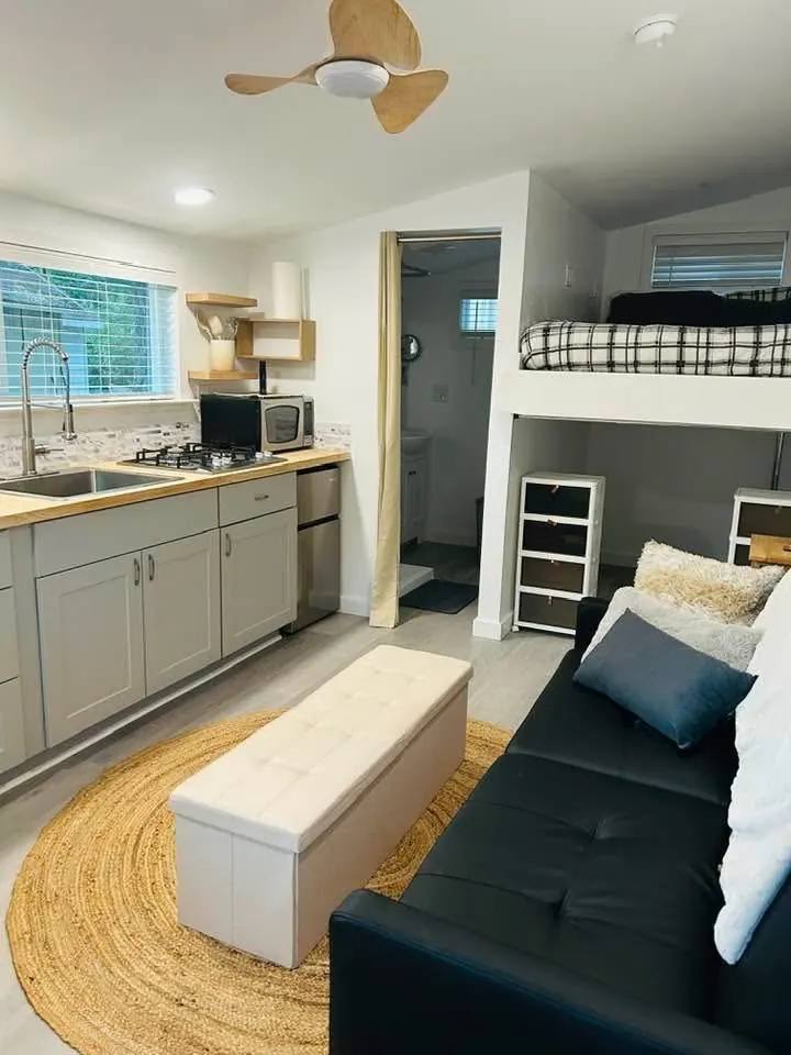 Bright guest studio with kitchenette built inside a former garage