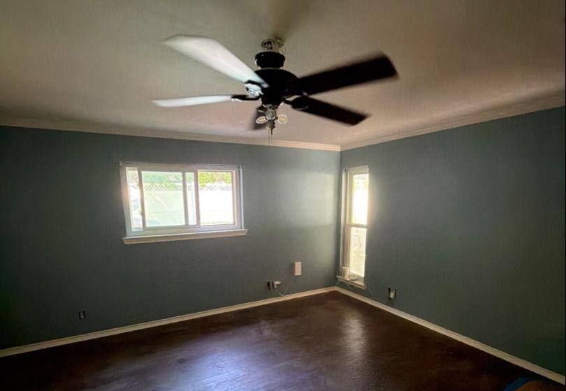 Before and after photo of a bedroom repainted by Hill Country Painting in Round Rock, TX