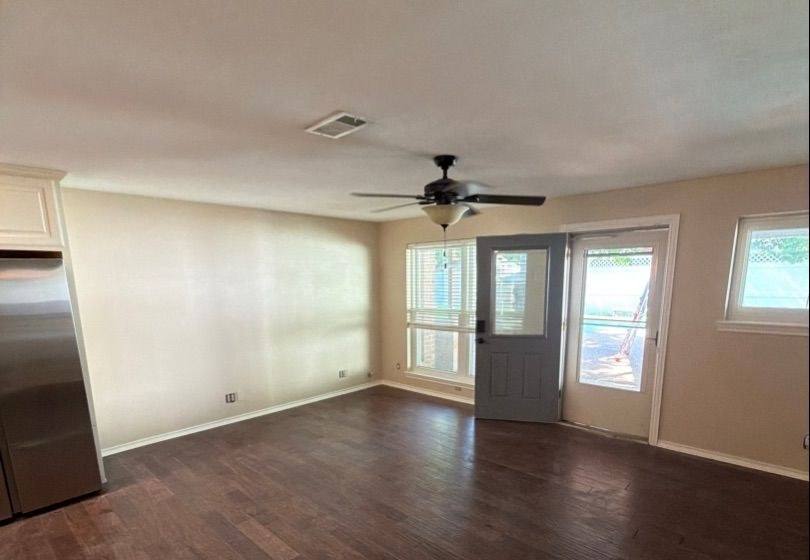 Before and after photo of a living room and kitchen repainted by Hill Country Painting in Round Rock, TX