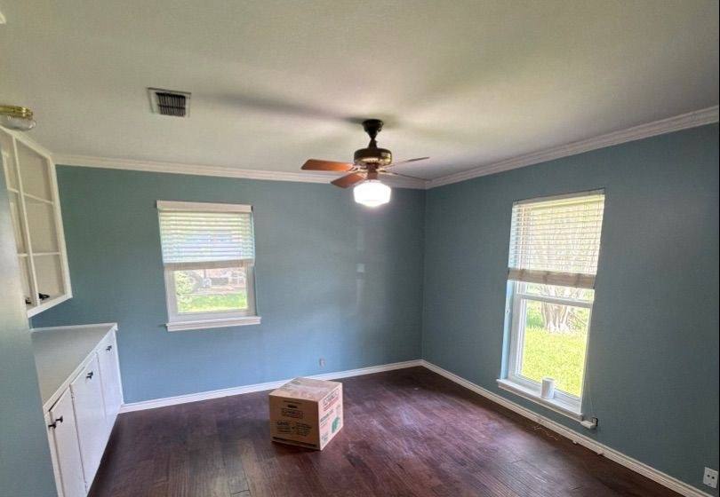 Before and after photo of a kitchen and breakfast nook repainted by Hill Country Painting in Round Rock, TX