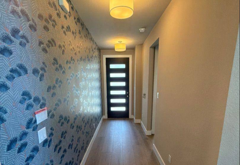 Before and after photo of an entry way repainted by Hill Country Painting in Dripping Springs, TX