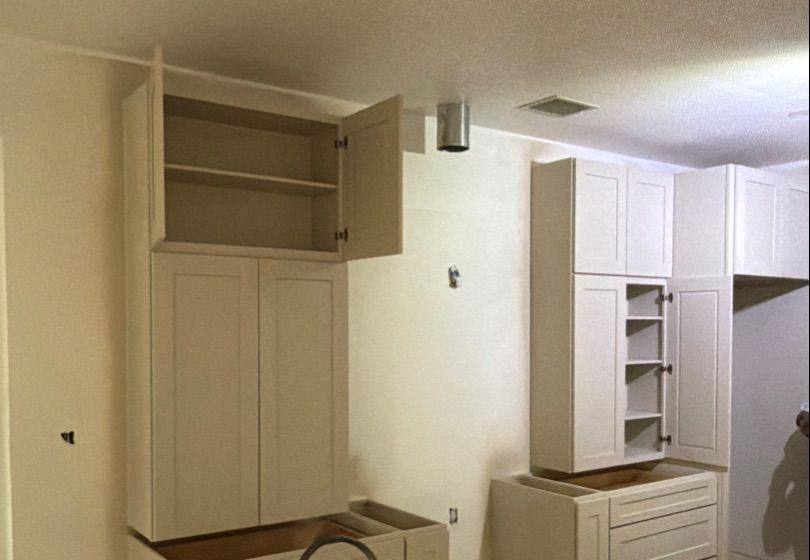 Before and after photo of pantry cabinets refinished by Hill Country Painting in Round Rock, TX