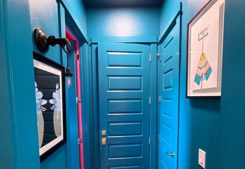 Before and after photo of a hallway repainted by Hill Country Painting in Austin, TX