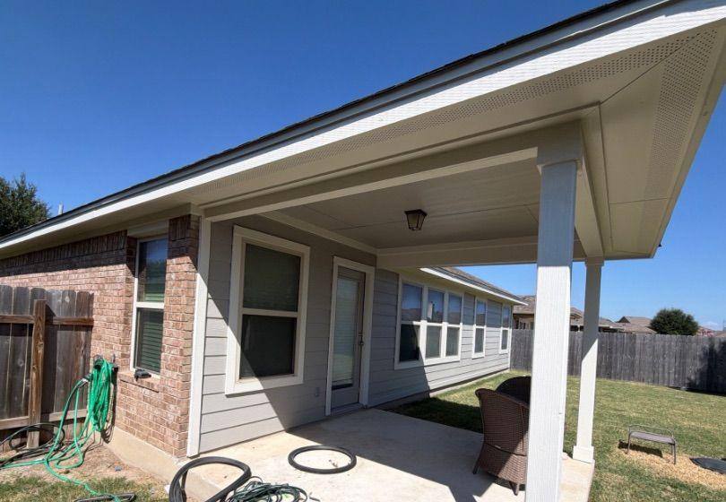 Before and after photo of a back porch repainted by Hill Country Painting in Pflugerville, TX