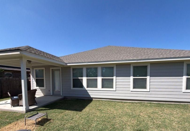 Before and after photo of the back of a house repainted by Hill Country Painting in Pflugerville, TX