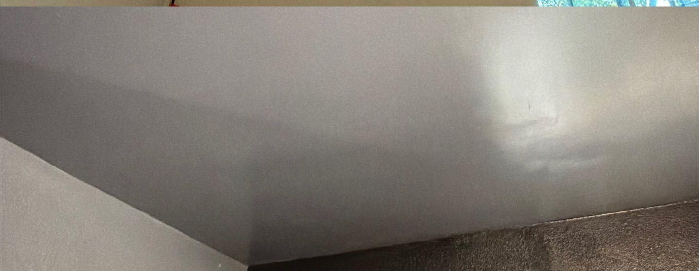 Before and after photo of a ceiling water damage repair by Hill Country Painting in Austin, TX