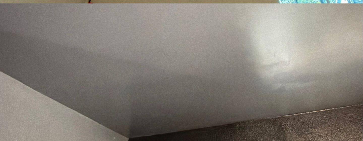 Before and after photo of a ceiling water damage repair by Hill Country Painting in Austin, TX