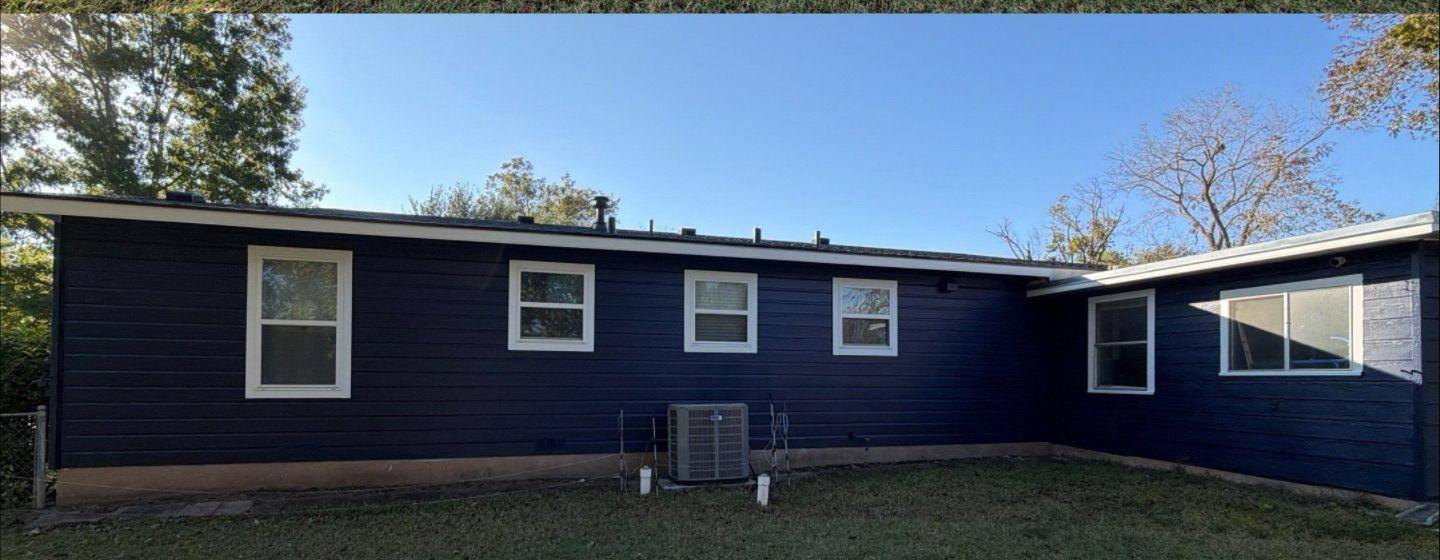 Before and after photo of a house exterior back painted by Hill Country Painting in Taylor, TX