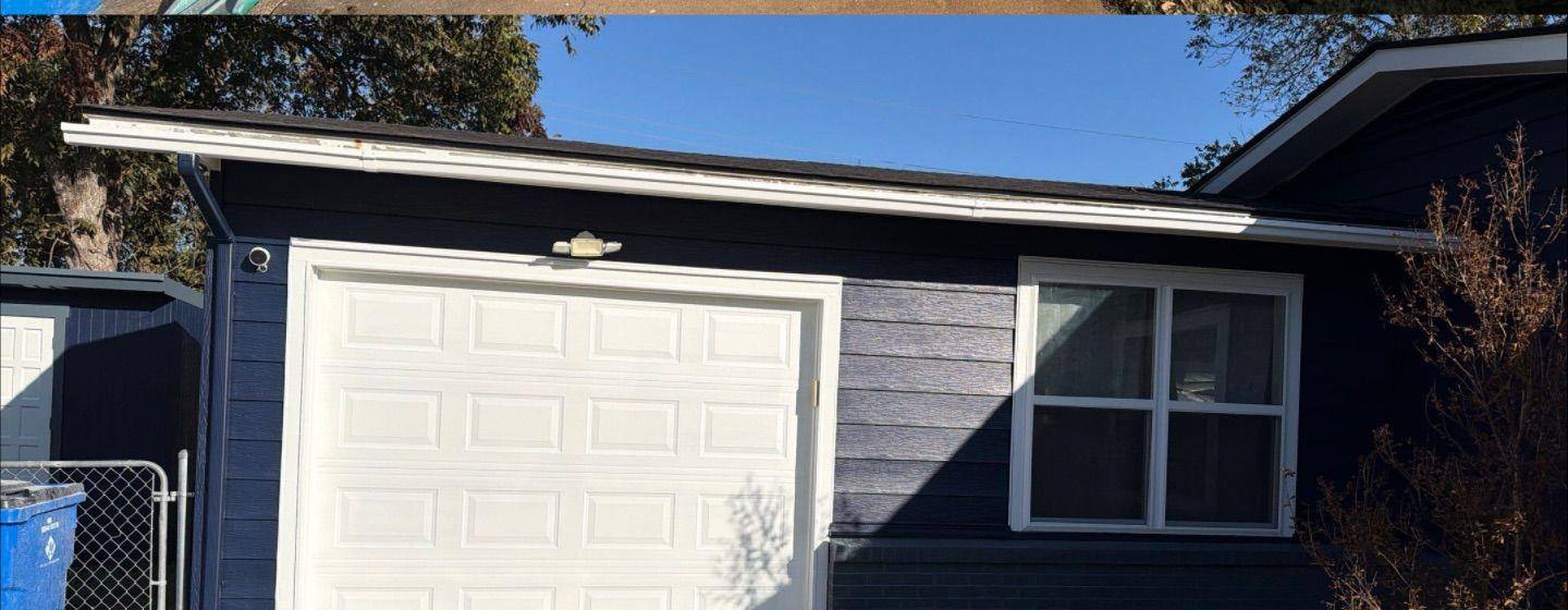 Before and after photo of a garage exterior painted by Hill Country Painting in Taylor, TX