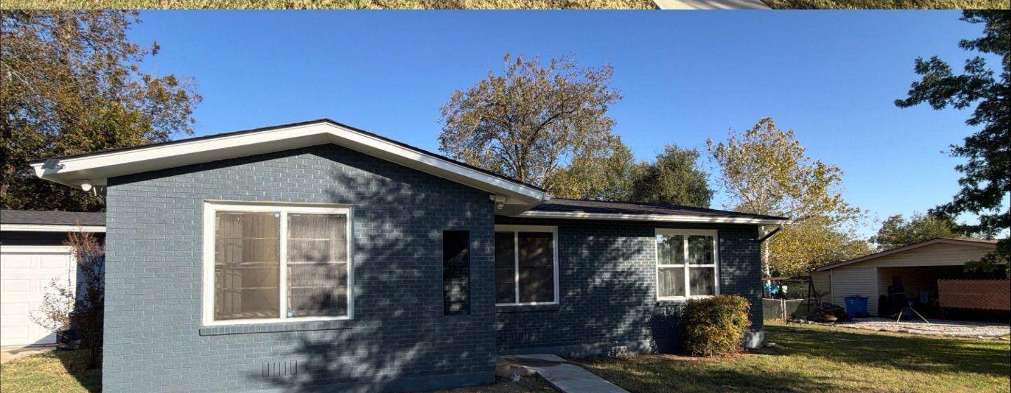 Before and after photo of exterior brick painted by Hill Country Painting in Taylor, TX