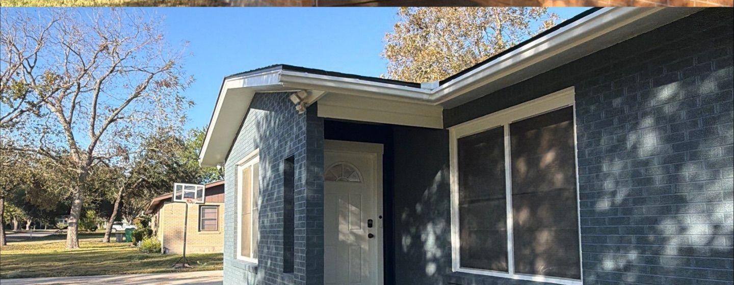 Before and after photo of a front entry painted by Hill Country Painting in Taylor, TX