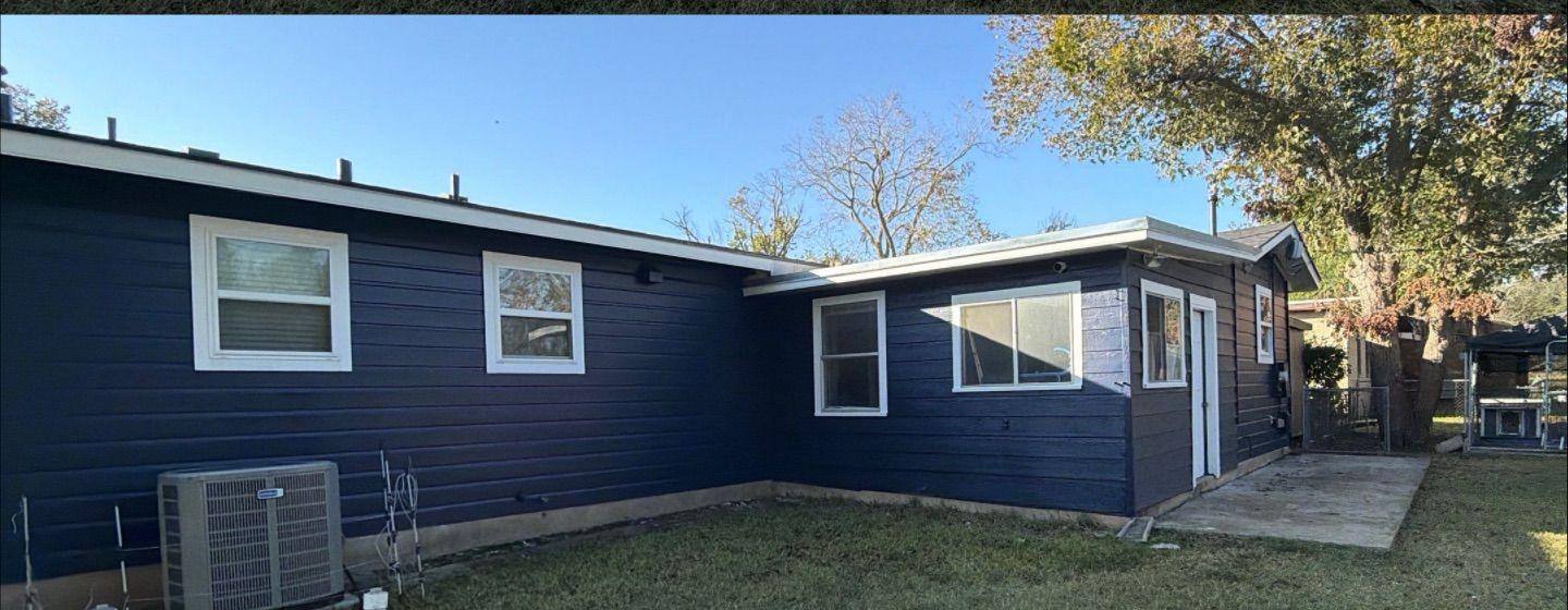 Before and after photo of a house exterior side painted by Hill Country Painting in Taylor, TX
