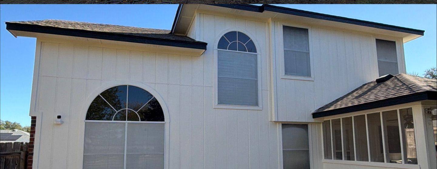 Before and after photo of a house exterior back painted by Hill Country Painting in Round Rock, TX