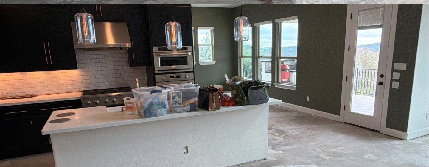 Before and after photo of a kitchen painted by Hill Country Painting in Leander, TX