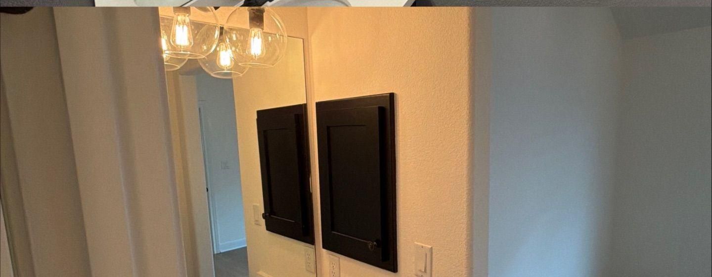 Before and after photo of a bathroom painted by Hill Country Painting in Leander, TX