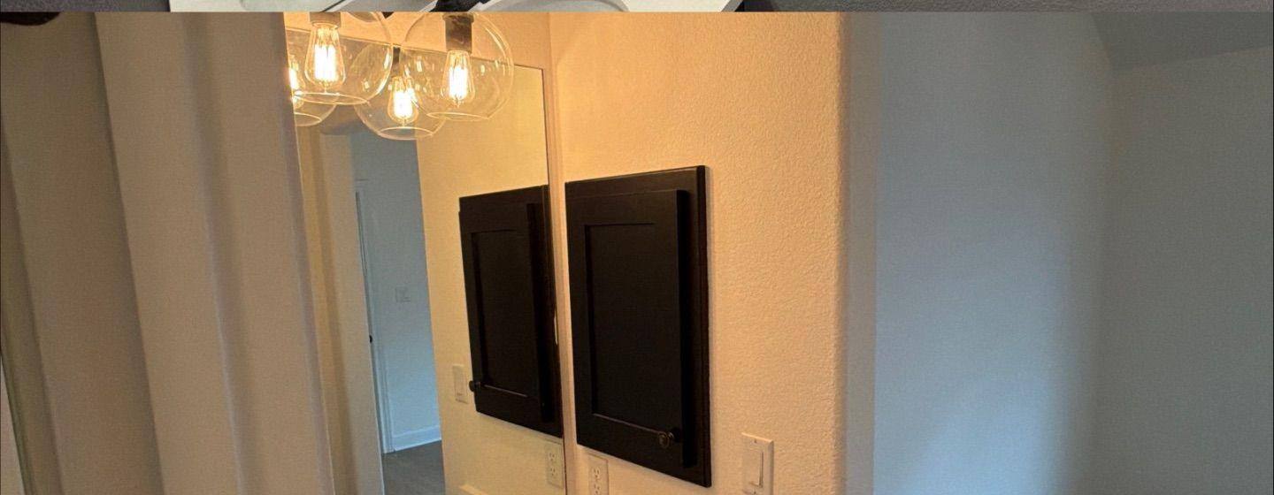 Before and after photo of a bathroom painted by Hill Country Painting in Leander, TX
