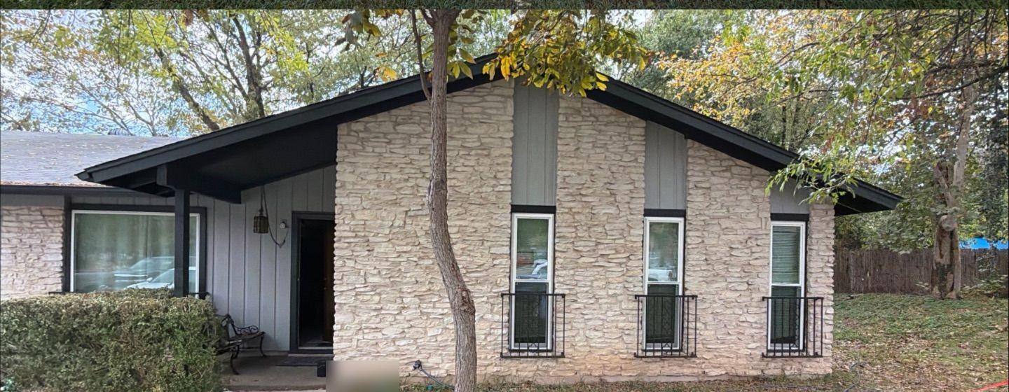 Before and after photo of a house exterior front painted by Hill Country Painting in Austin, TX