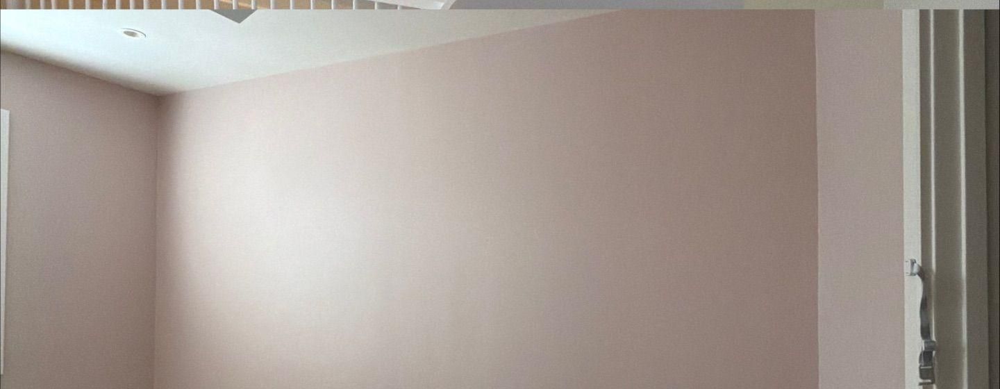 Before and after photo of a bedroom accent wall painted by Hill Country Painting in Austin, TX