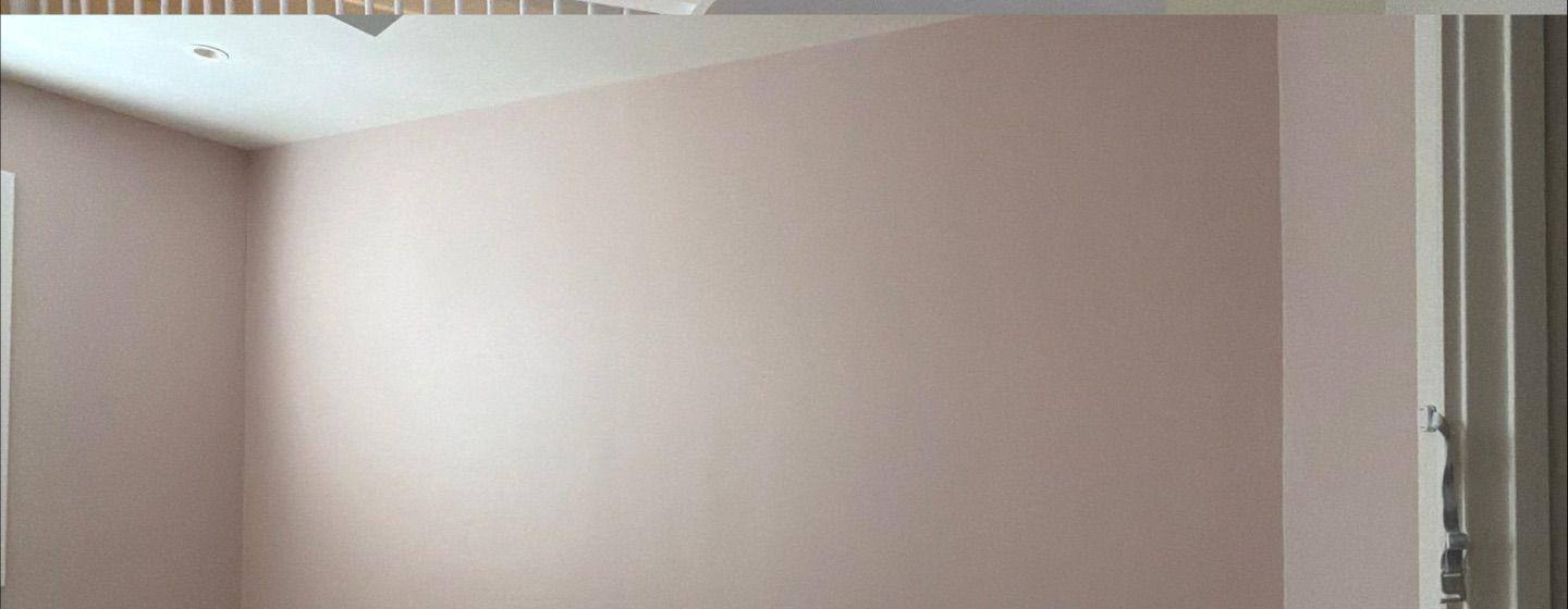 Before and after photo of a bedroom accent wall painted by Hill Country Painting in Austin, TX