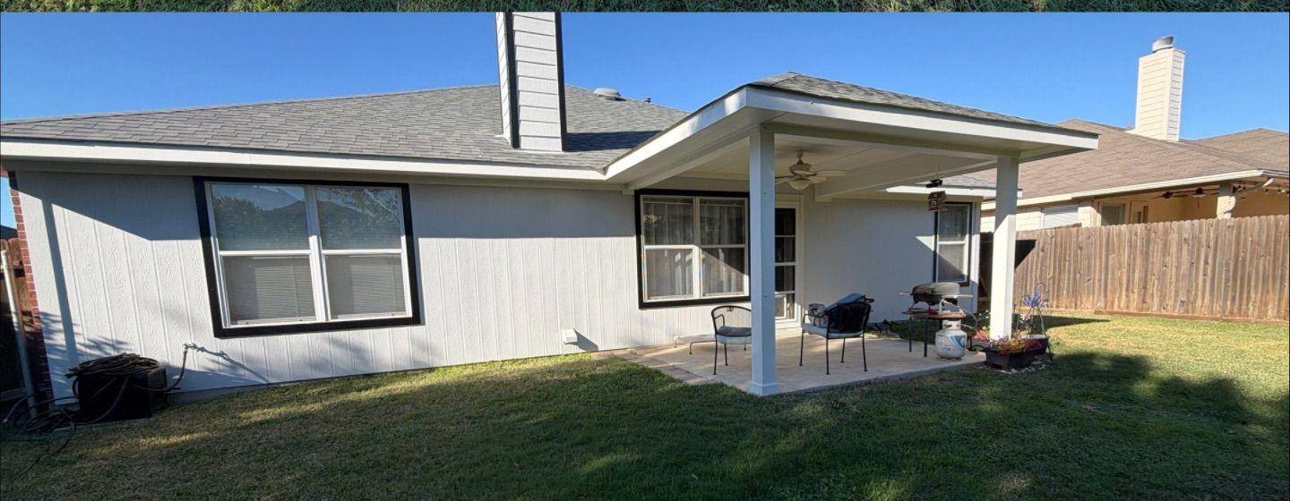 Before and after photo of a house exterior side painted by Hill Country Painting in Leander, TX