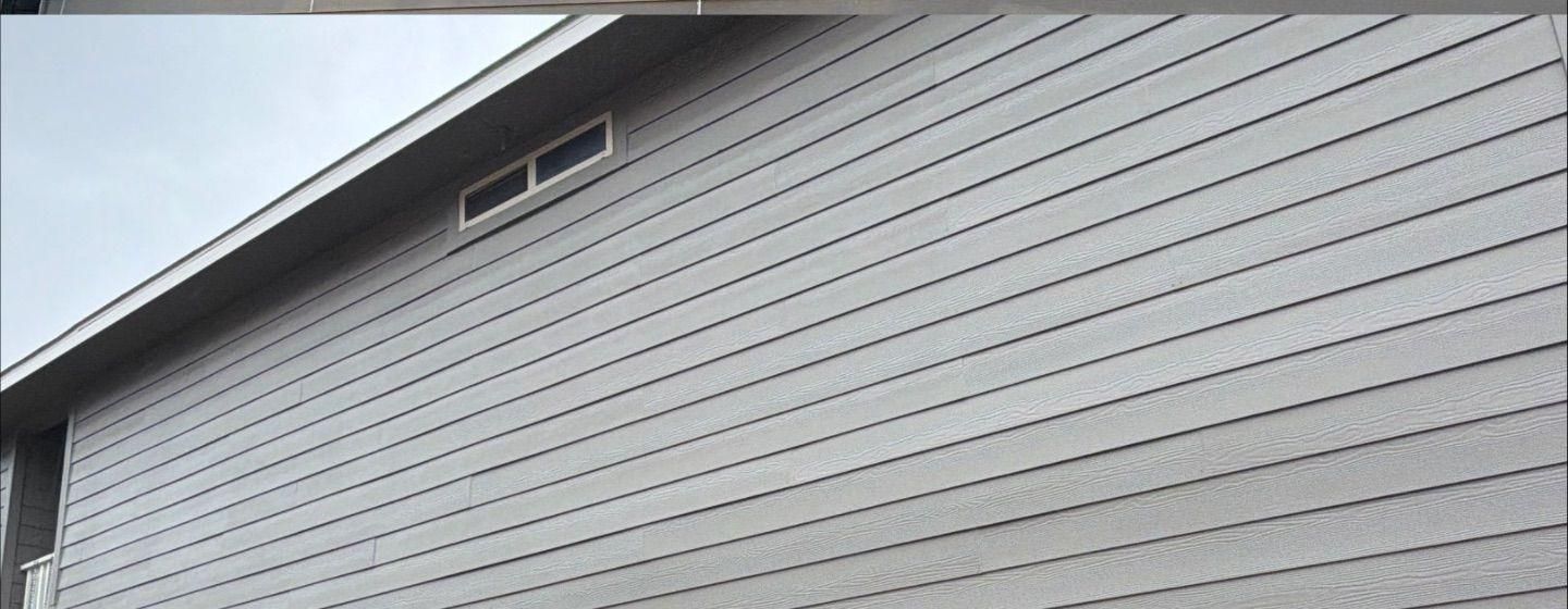 Before and after photo of a house gable and roofline painted by Hill Country Painting in Leander, TX