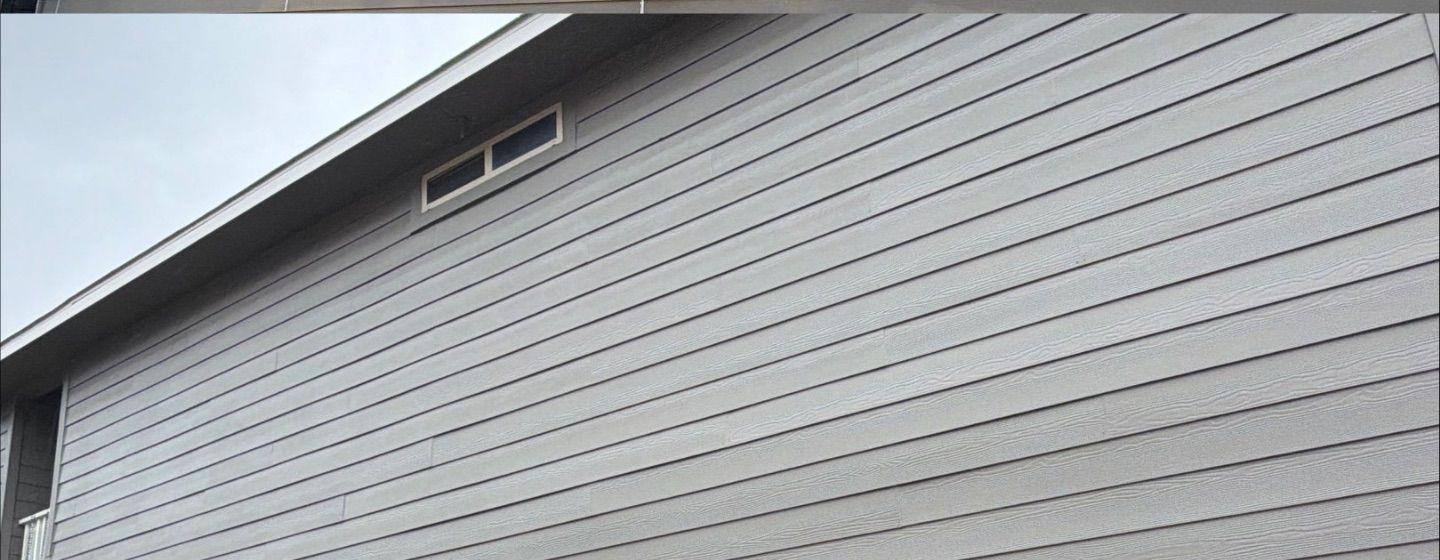 Before and after photo of a house gable and roofline painted by Hill Country Painting in Leander, TX