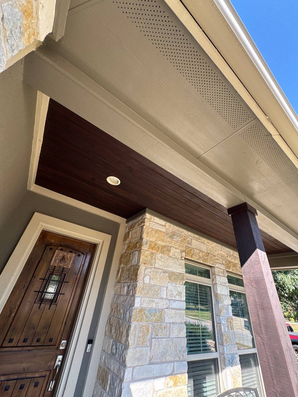 Front entry of a home in Leander, TX prior to exterior wood staining by Hill Country Painting