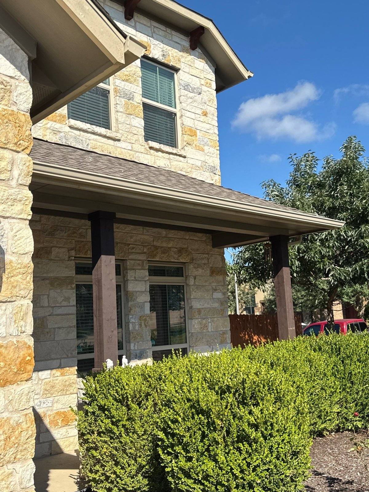 Front entry post and corbels of a home in Leander, TX ahead of stain matching by Hill Country Painting