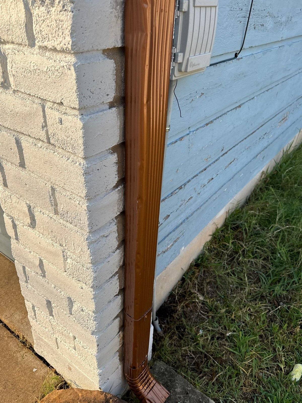 Weathered original blue siding ahead of a whole-house exterior repaint in Austin, TX by Hill Country Painting