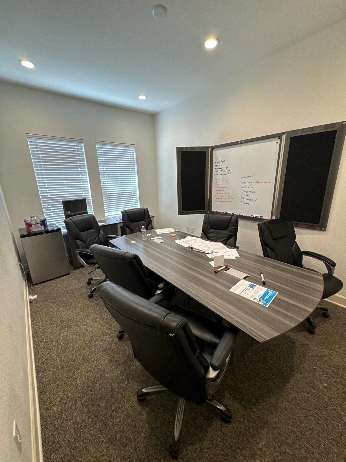 Conference room prepped ahead of an interior repaint at an office suite in Round Rock, TX by Hill Country Painting