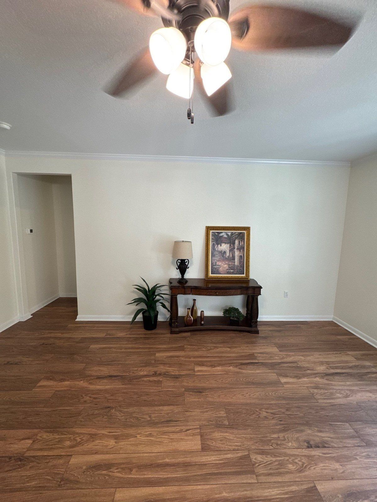 Entryway with wood flooring ahead of an interior accent wall painting project in Georgetown, TX by Hill Country Painting