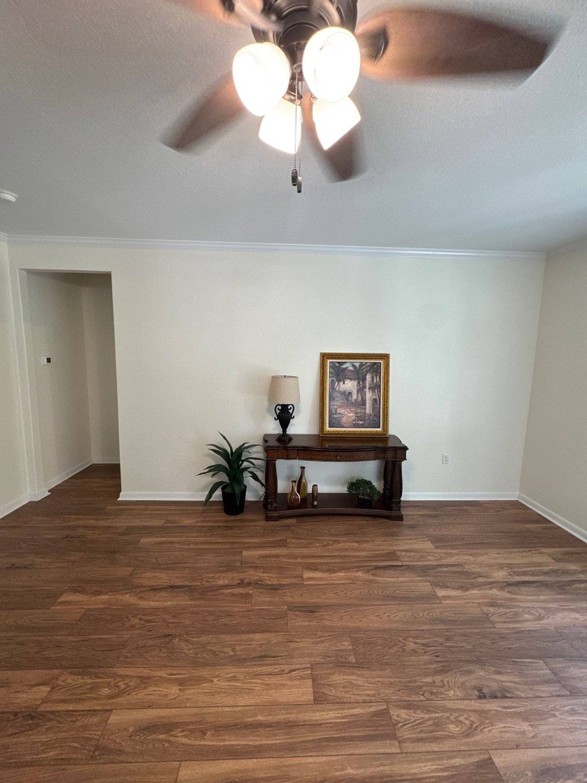Entryway with wood flooring ahead of an interior accent wall painting project in Georgetown, TX by Hill Country Painting