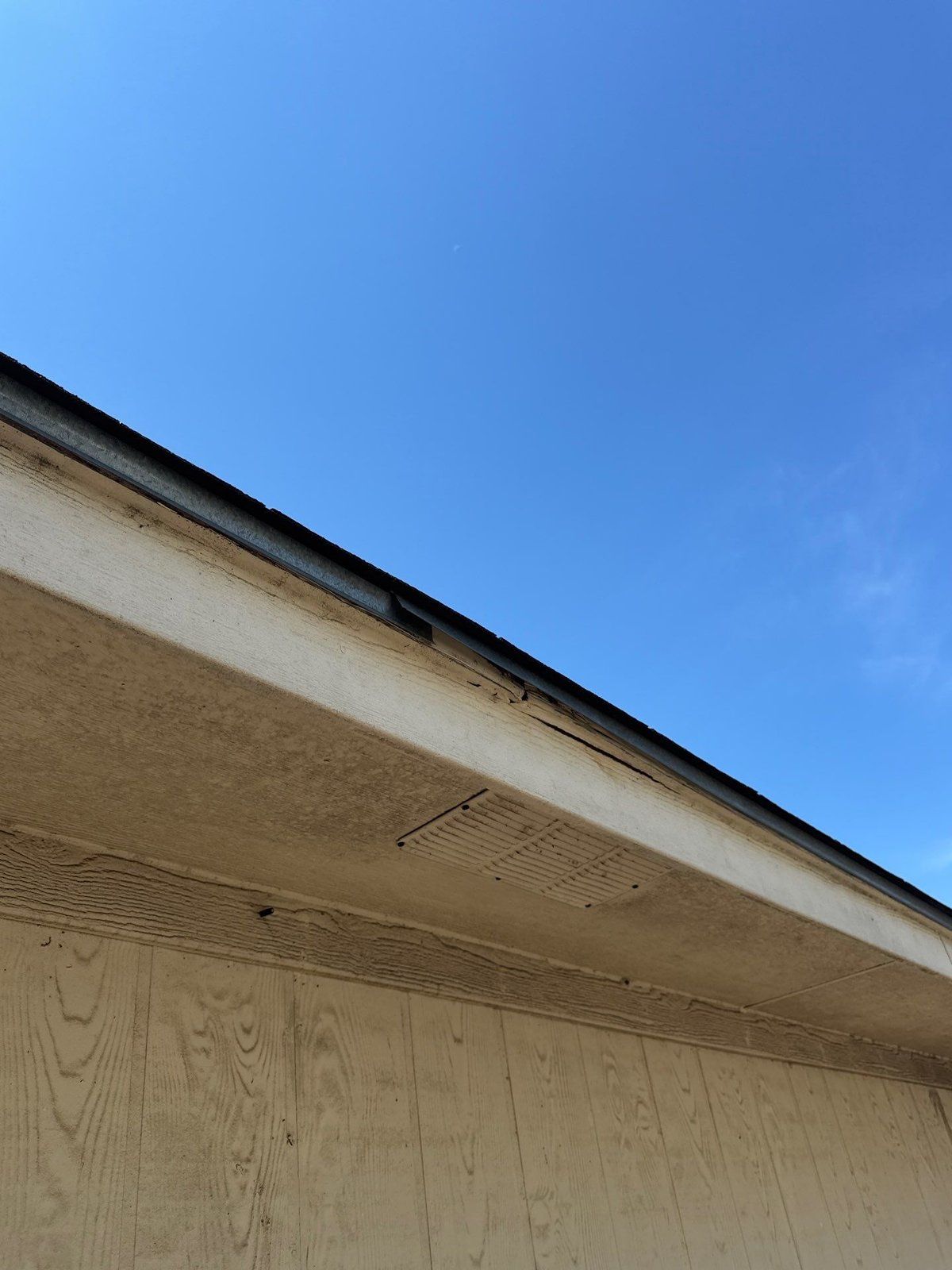 Fascia and soffit damage ahead of an exterior repaint in Pflugerville, TX by Hill Country Painting