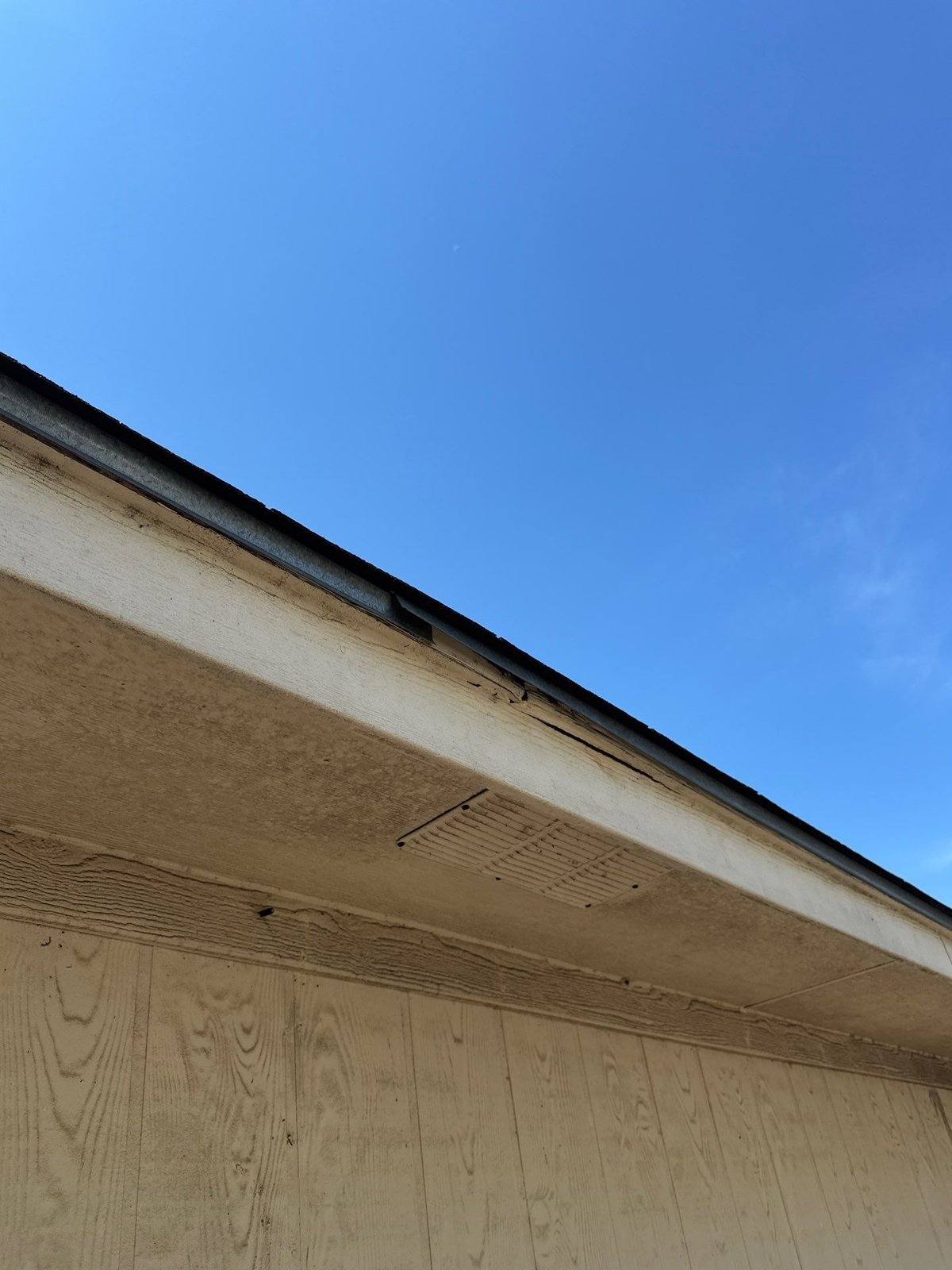 Fascia and soffit damage ahead of an exterior repaint in Pflugerville, TX by Hill Country Painting