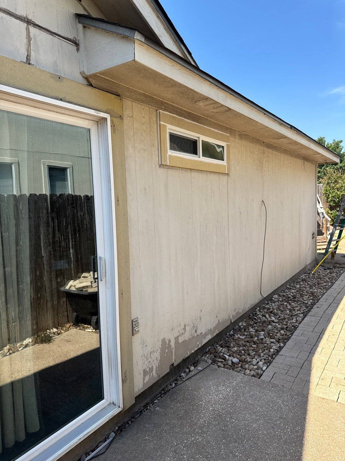 Peeling paint on exterior siding ahead of a repaint in Pflugerville, TX by Hill Country Painting