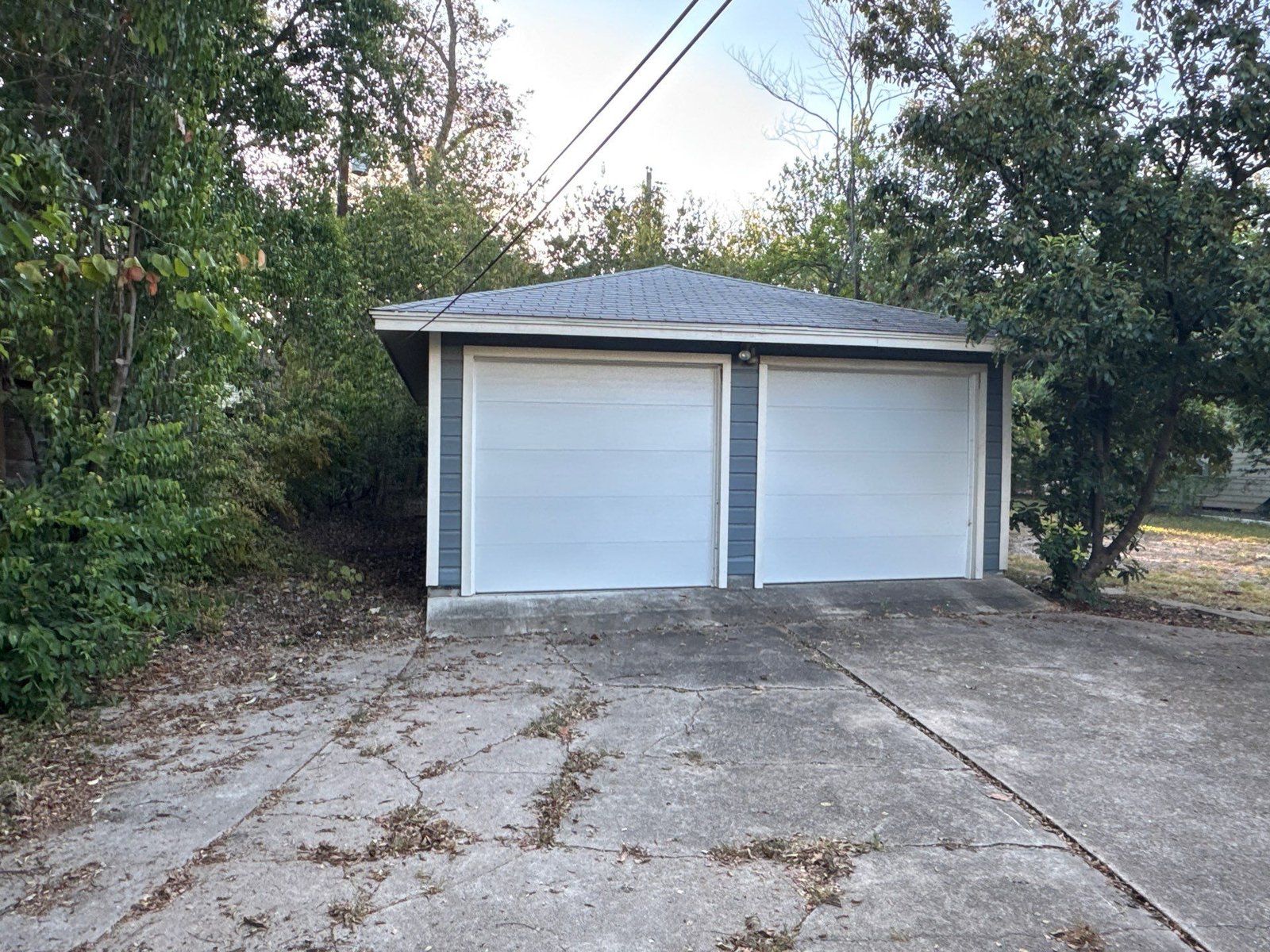 Detached garage with matching siding in Austin, TX by Hill Country Painting