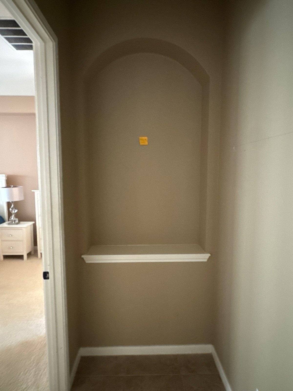 Arched wall niche prepped for painting in Austin, TX by Hill Country Painting