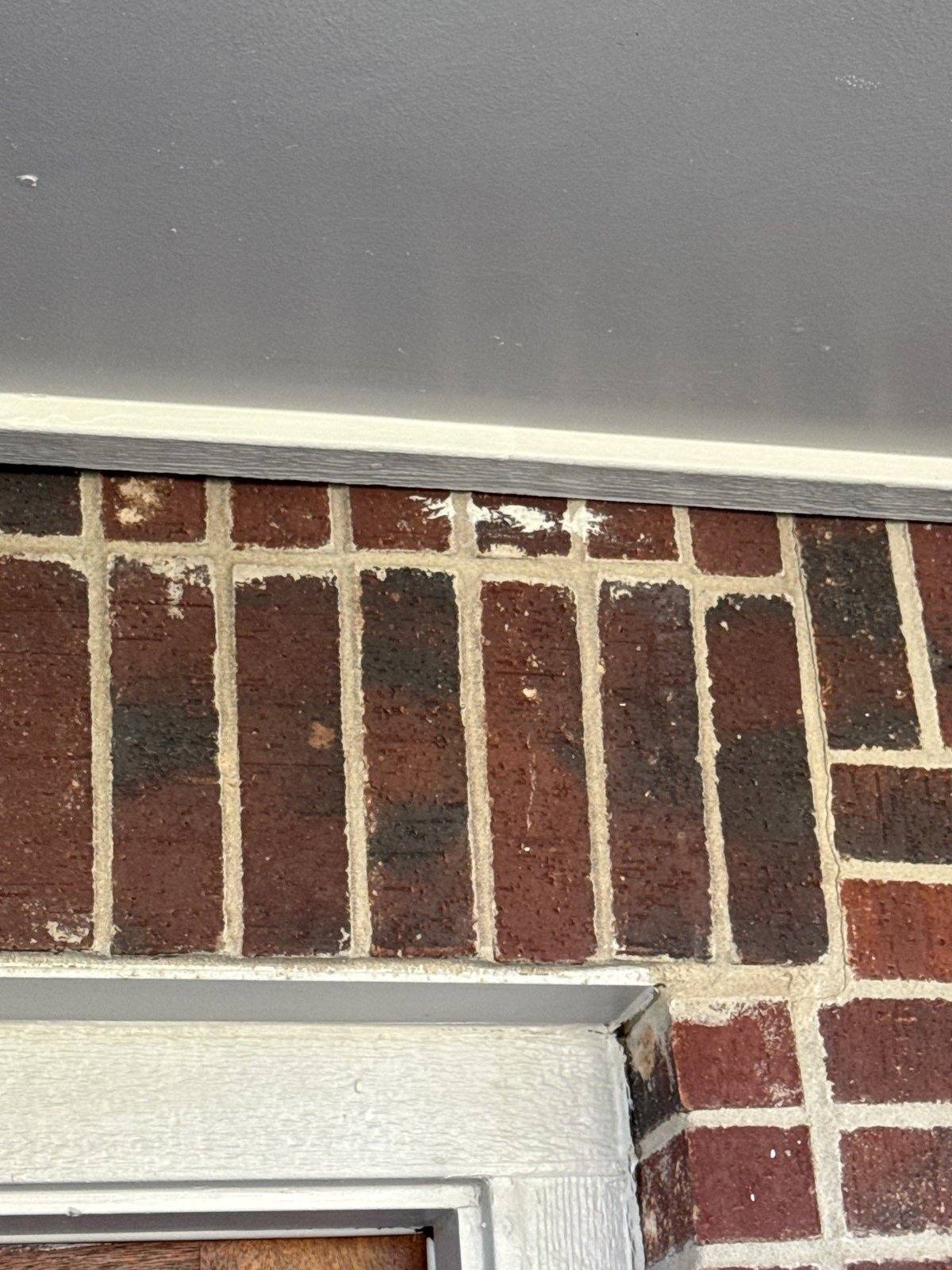 Fascia and brick trim before painting in Austin, TX by Hill Country Painting