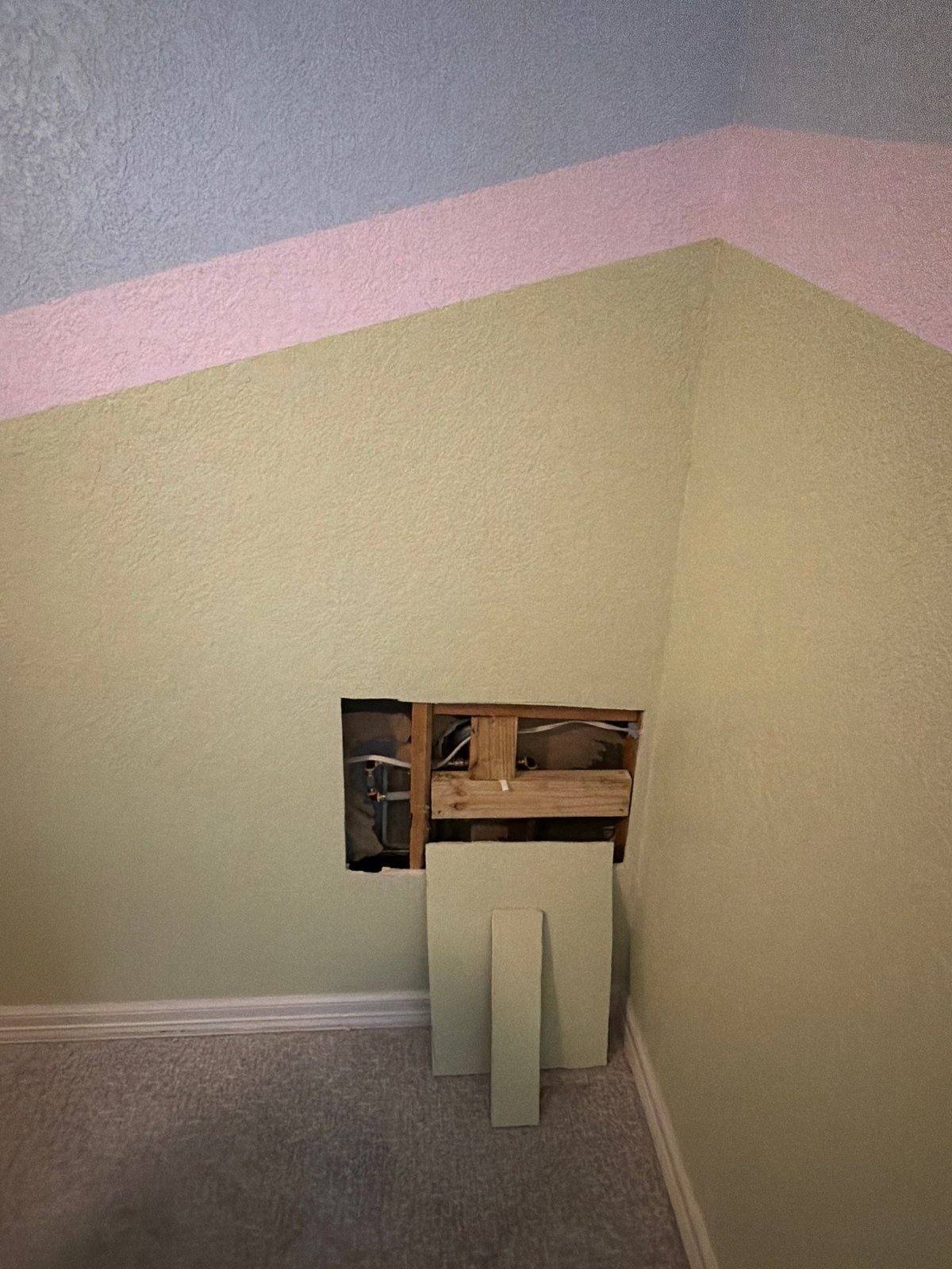 Bedroom wall before painting and drywall repair in Georgetown, TX by Hill Country Painting