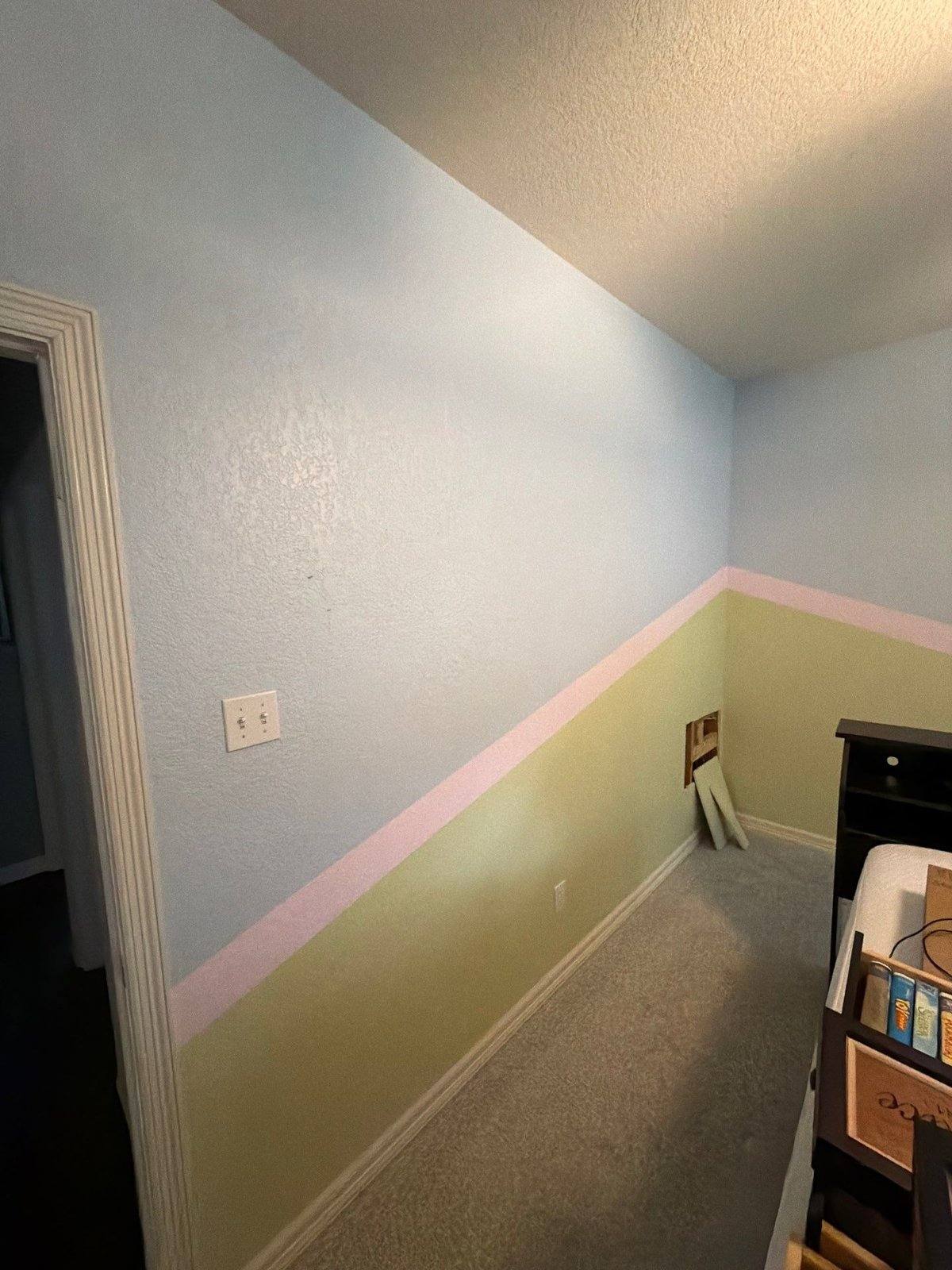 Bedroom corner before painting and drywall repair in Georgetown, TX by Hill Country Painting
