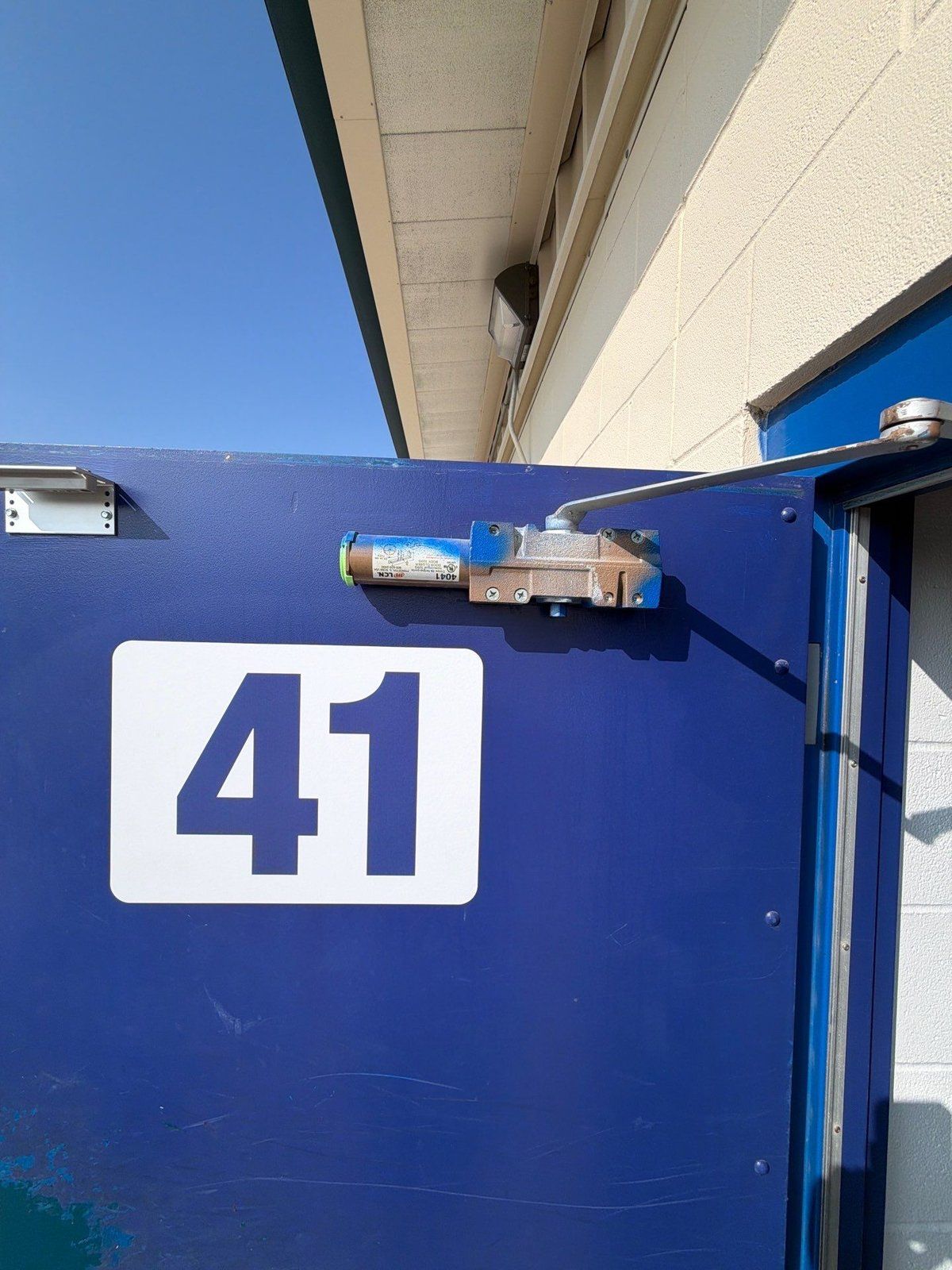 Locker room exterior door before painting in Jarrell, TX by Hill Country Painting
