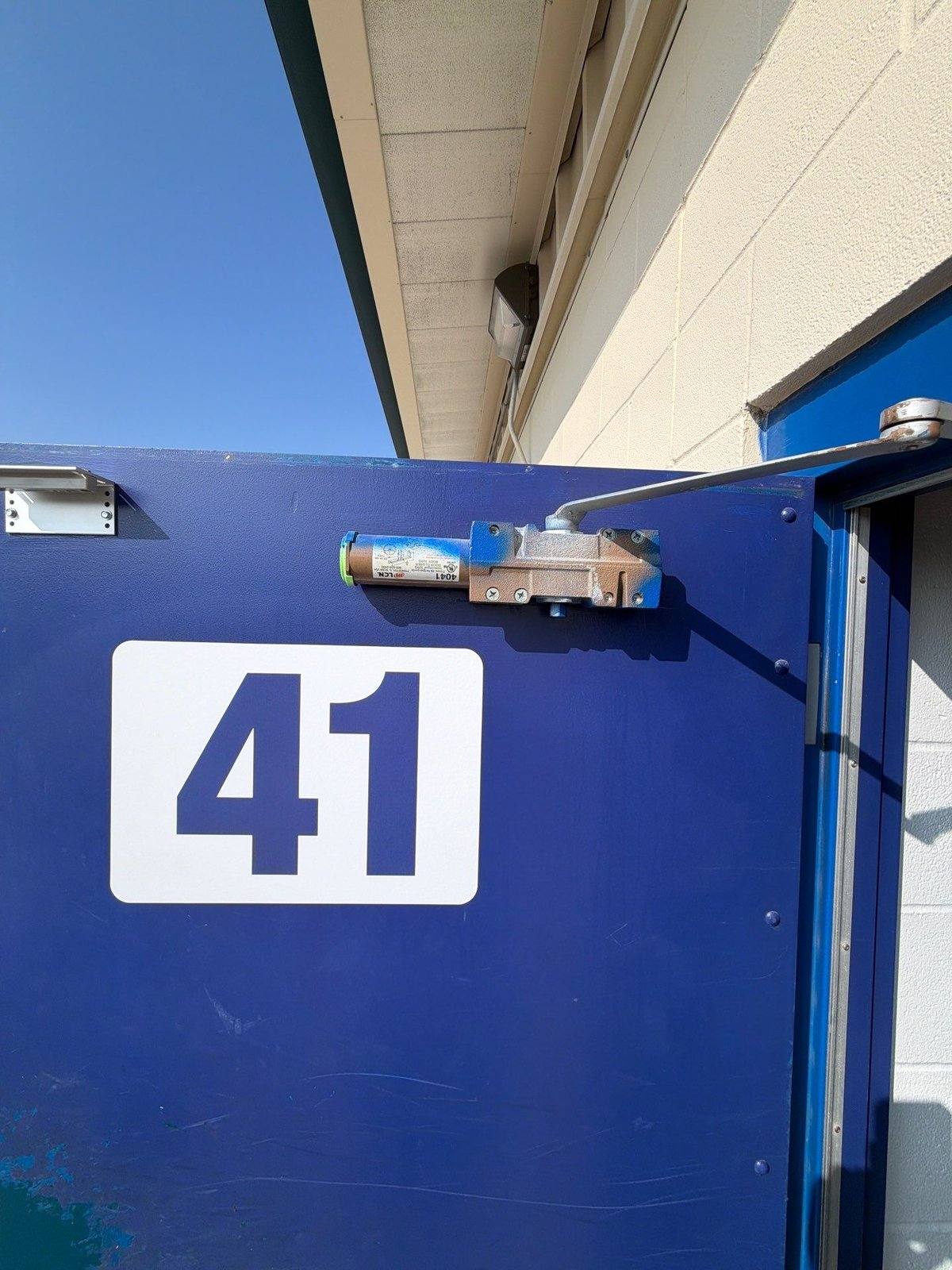 Locker room exterior door before painting in Jarrell, TX by Hill Country Painting