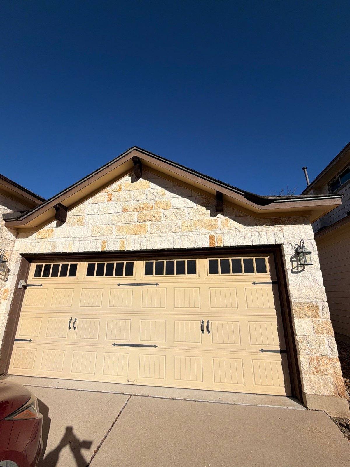 Garage and gable before exterior painting in Austin, TX by Hill Country Painting