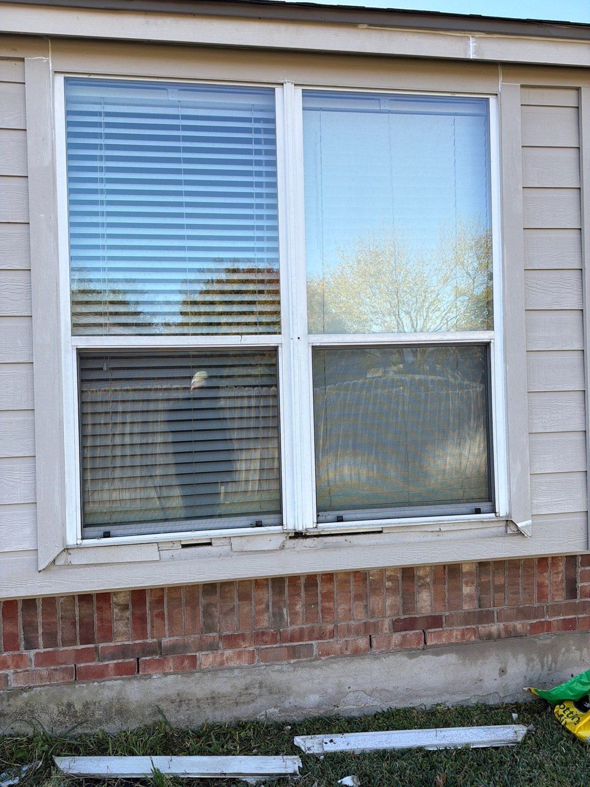 Window and siding before exterior painting in Pflugerville, TX by Hill Country Painting