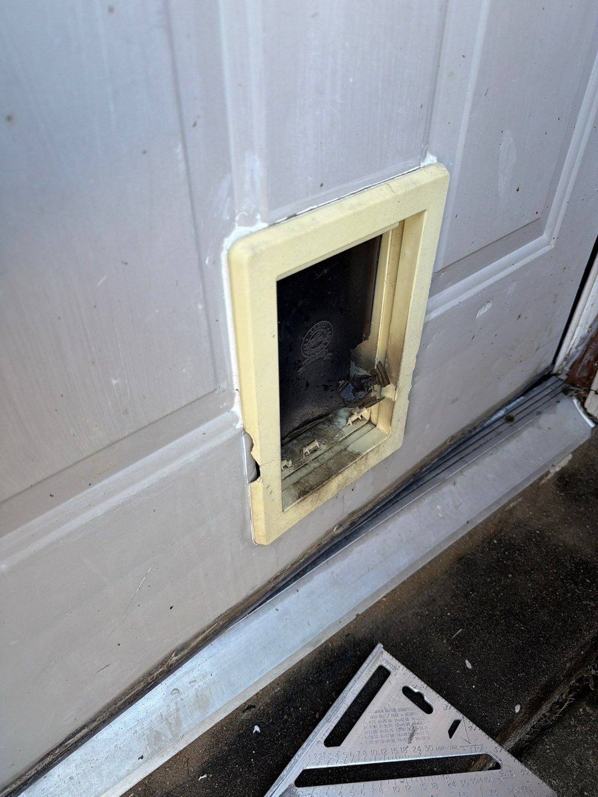 Door before exterior painting in Pflugerville, TX by Hill Country Painting