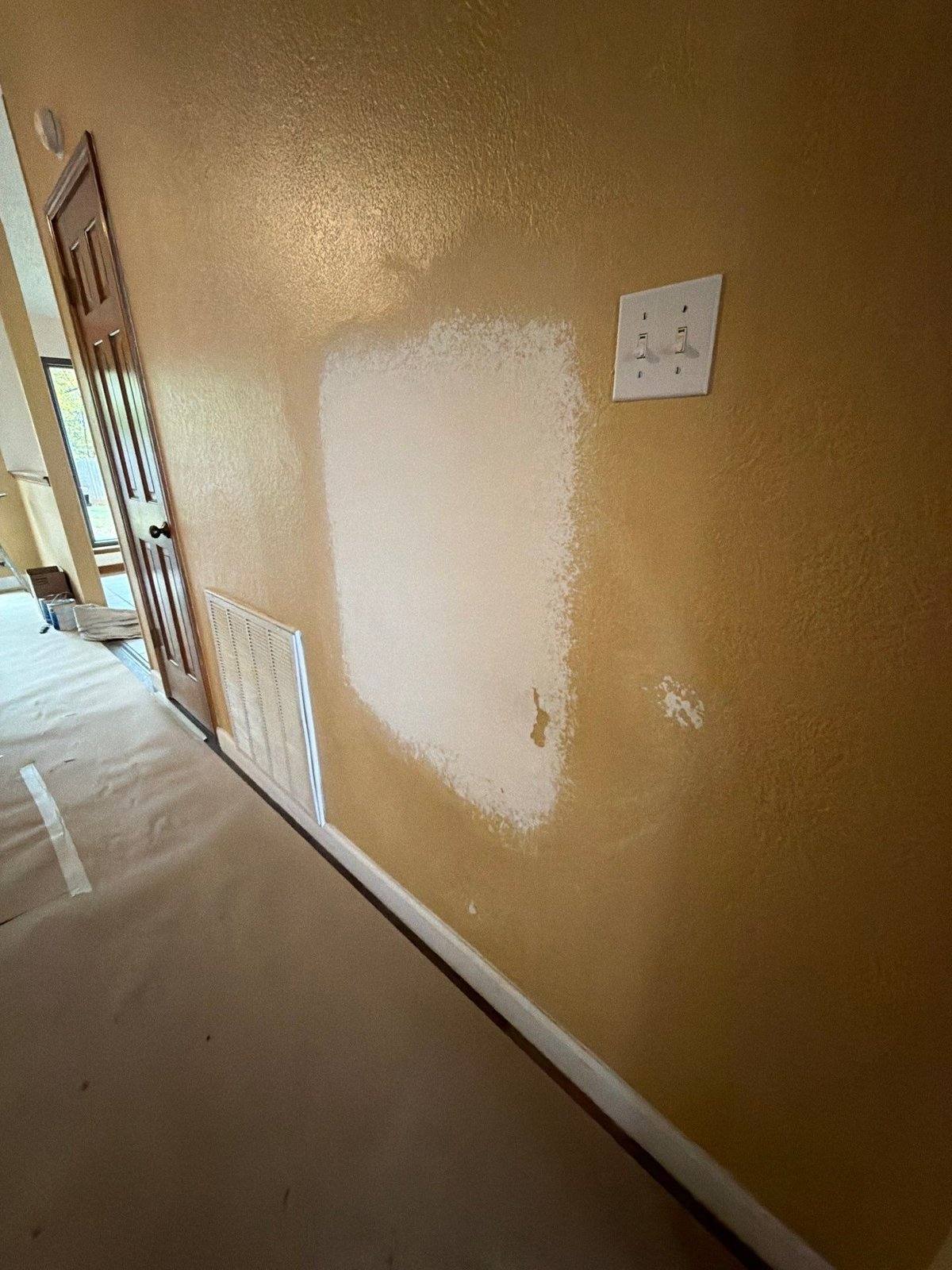 Wall repair prep before interior painting in Round Rock, TX by Hill Country Painting