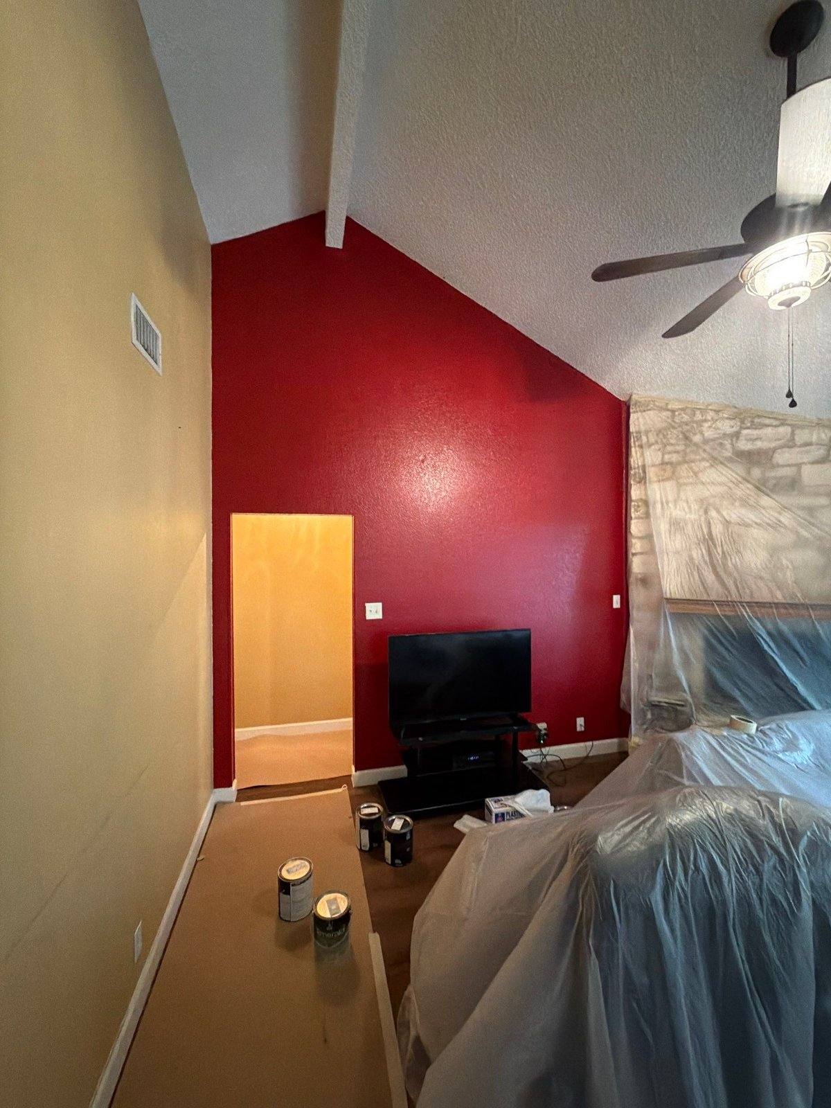 Living area with accent wall before painting in Round Rock, TX by Hill Country Painting