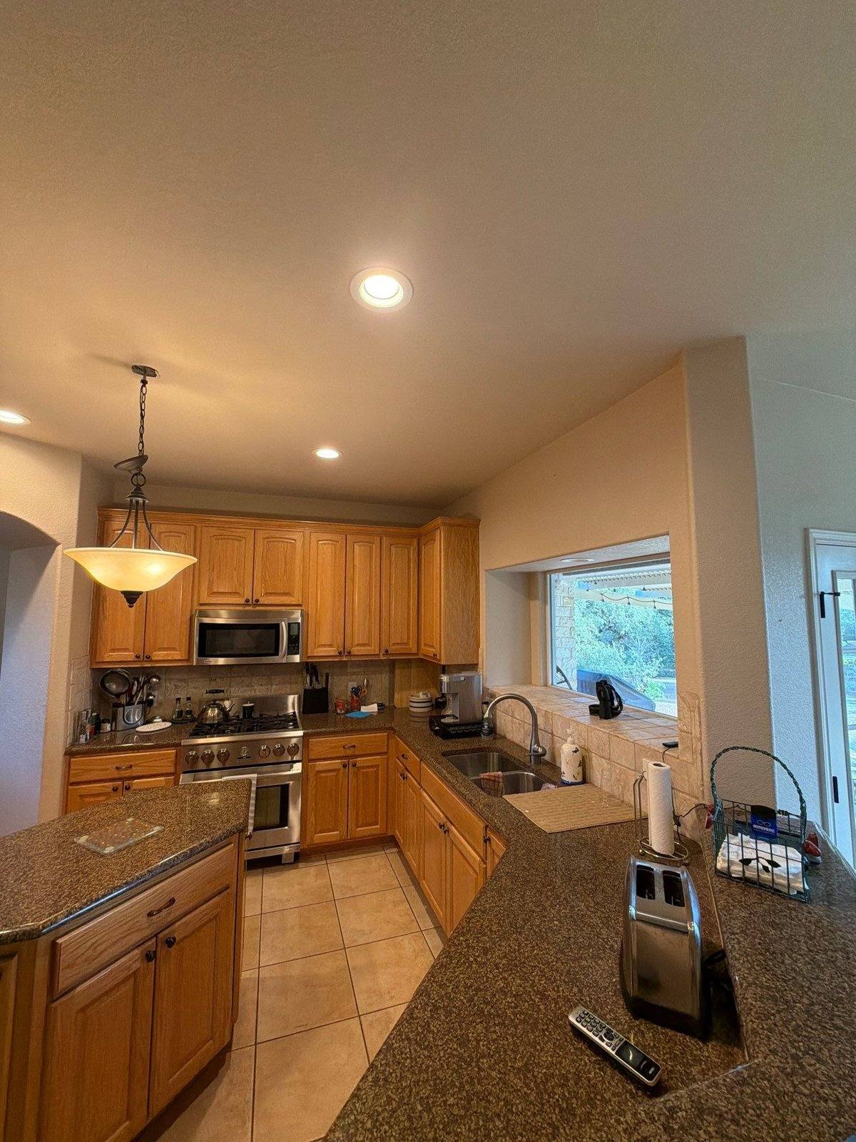 Kitchen before painting in Georgetown, TX by Hill Country Painting