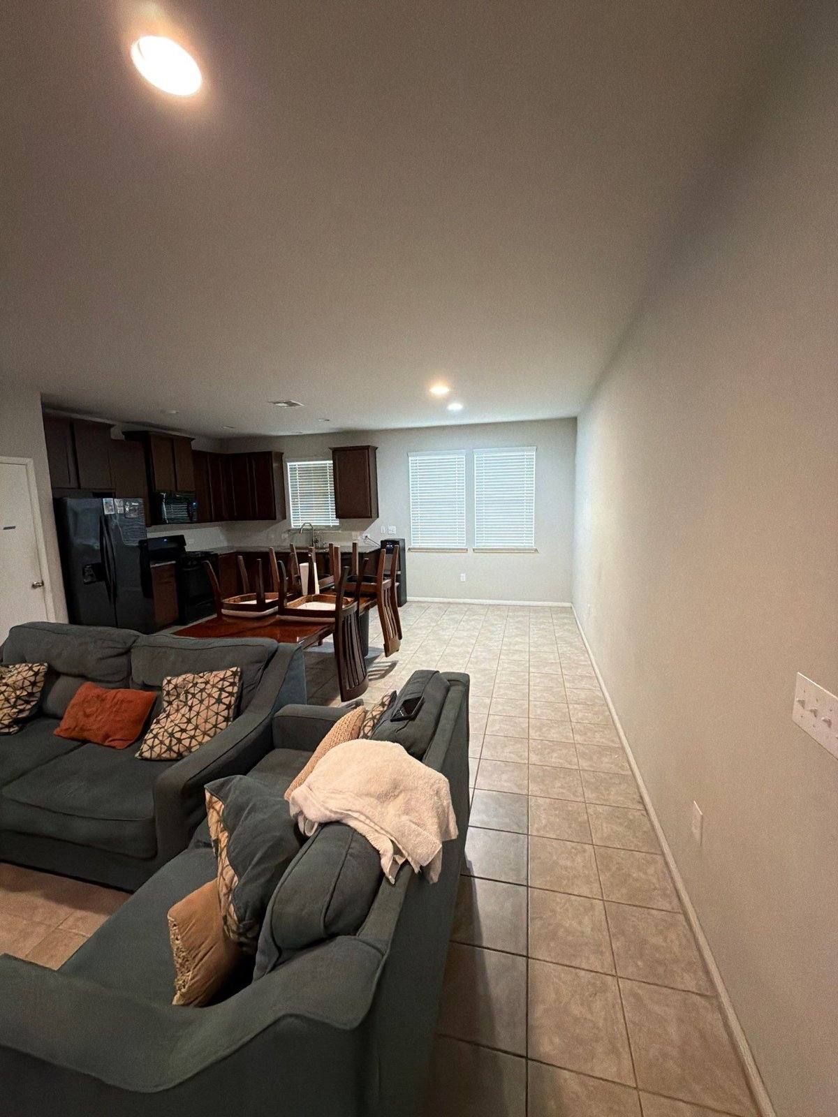 Living room and kitchen before painting in Buda, TX by Hill Country Painting